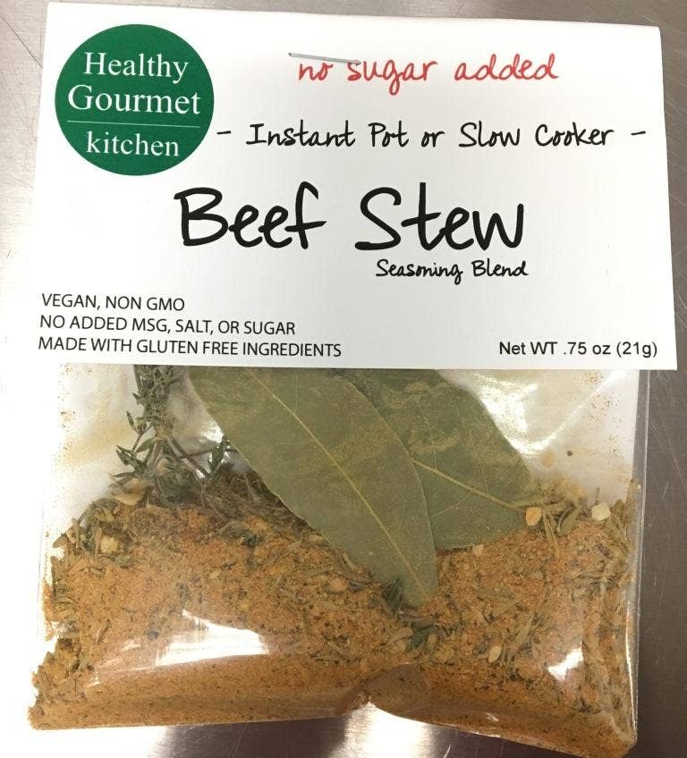 Beef Stew seasoning blend package with visible ingredients on a metallic surface