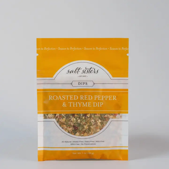 toasted red pepper & thyme dip in 1 oz plastic package with 'salt sisters' branding on a gray background