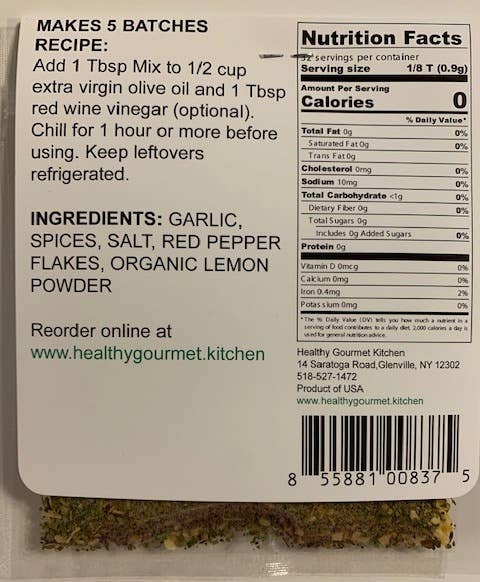 Back of a food packaging label with text, nutrition facts, and ingredients.