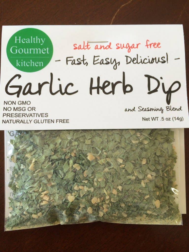 Packaging of Garlic Herb Dip from Healthy Gourmet Kitchen on a wooden surface