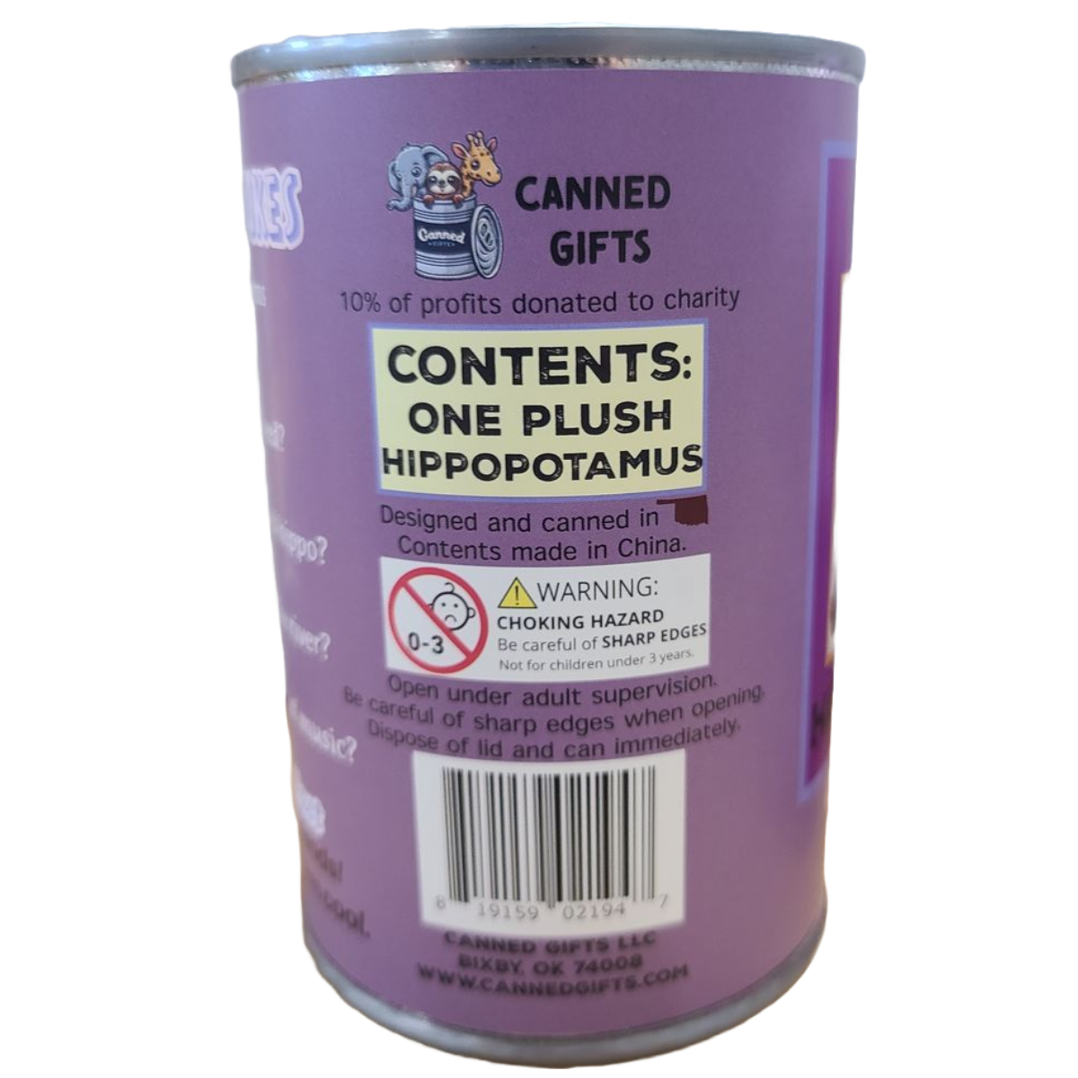Purple can labeled 'Canned Gifts' with plush hippopotamus contents and charitable information.