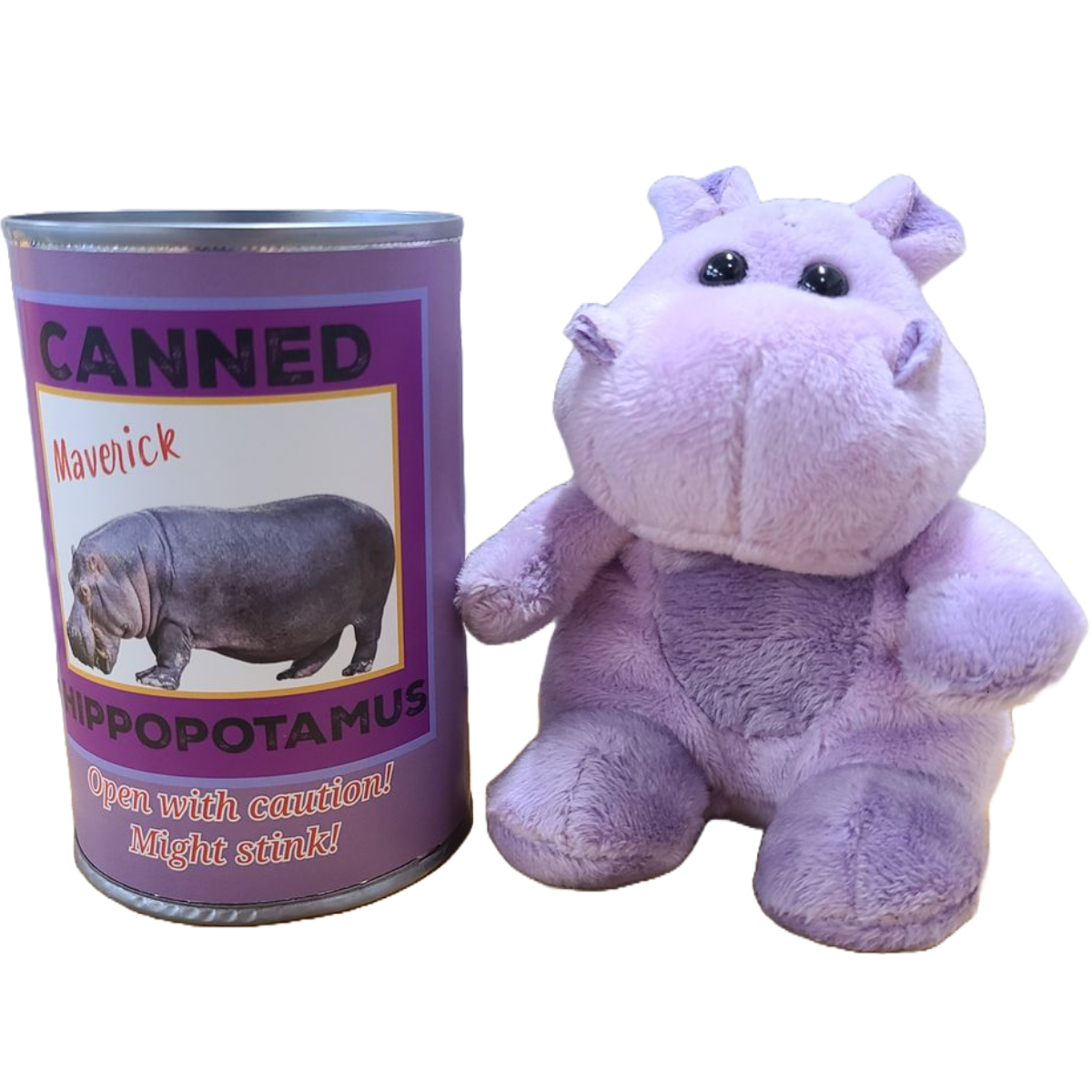 Plush hippo toy next to a can labeled 'Canned Hippopotamus' on a white background